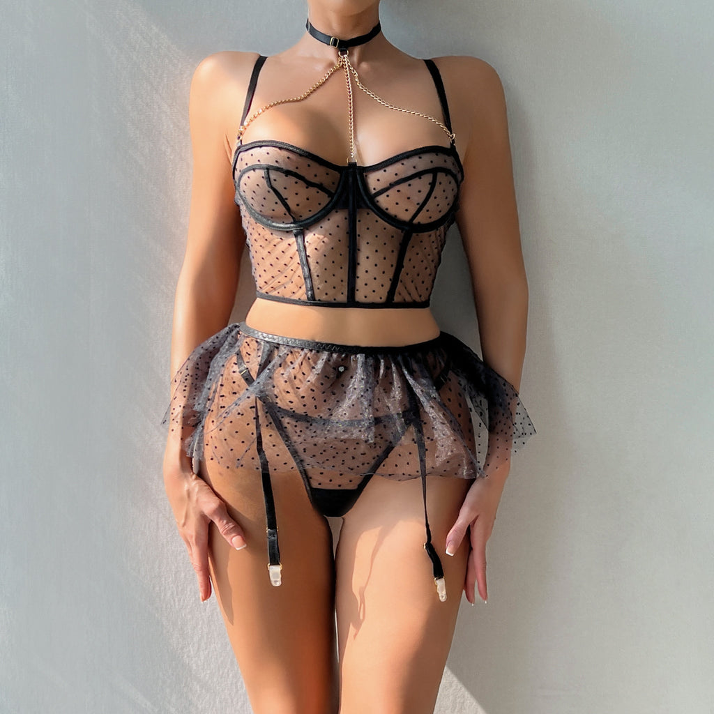 Black strappy bustier three-piece lingerie set with sheer-look skirt overlay - back view